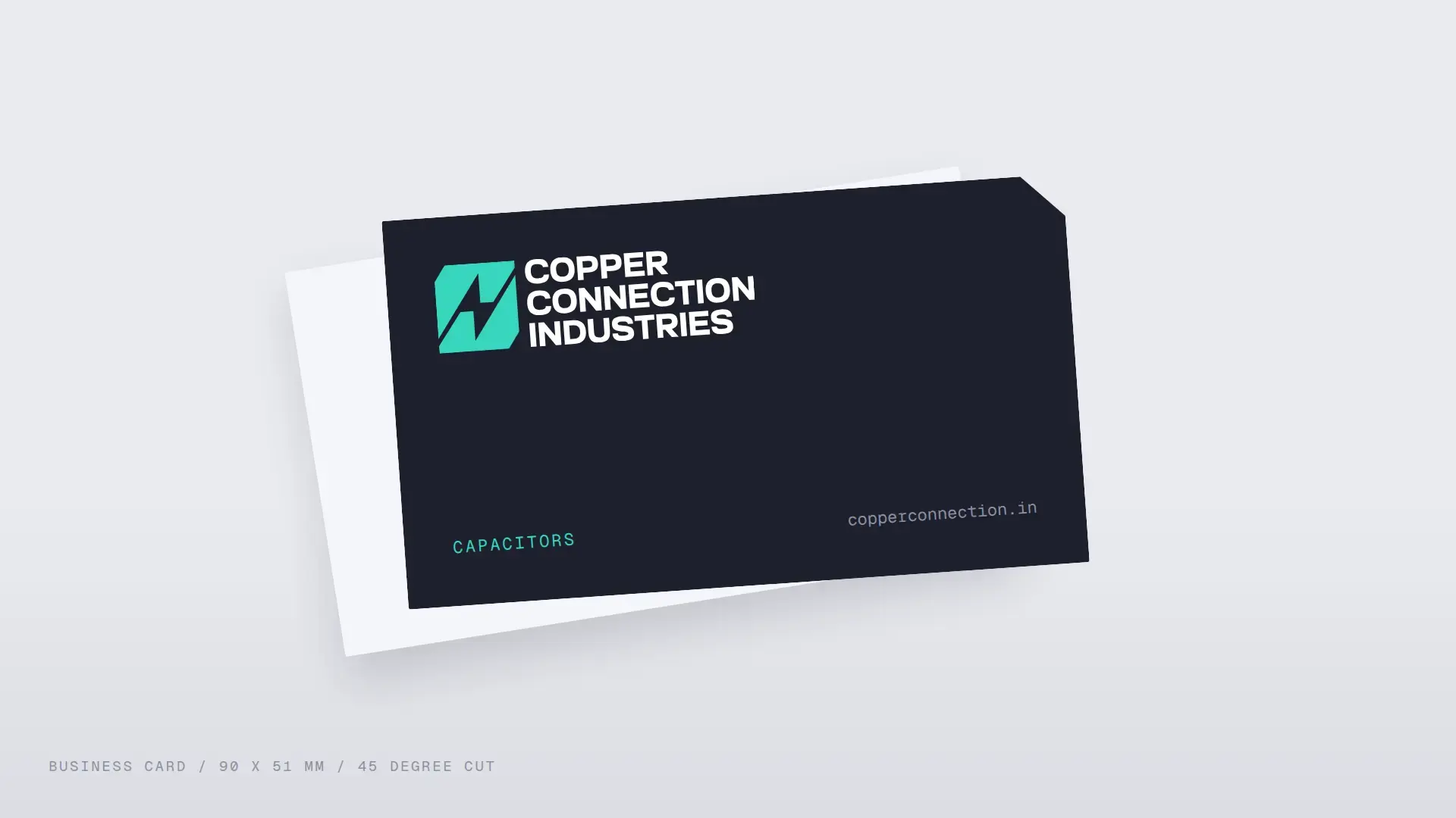 Graphite CCI business card with a turquoise logo and a cut corner