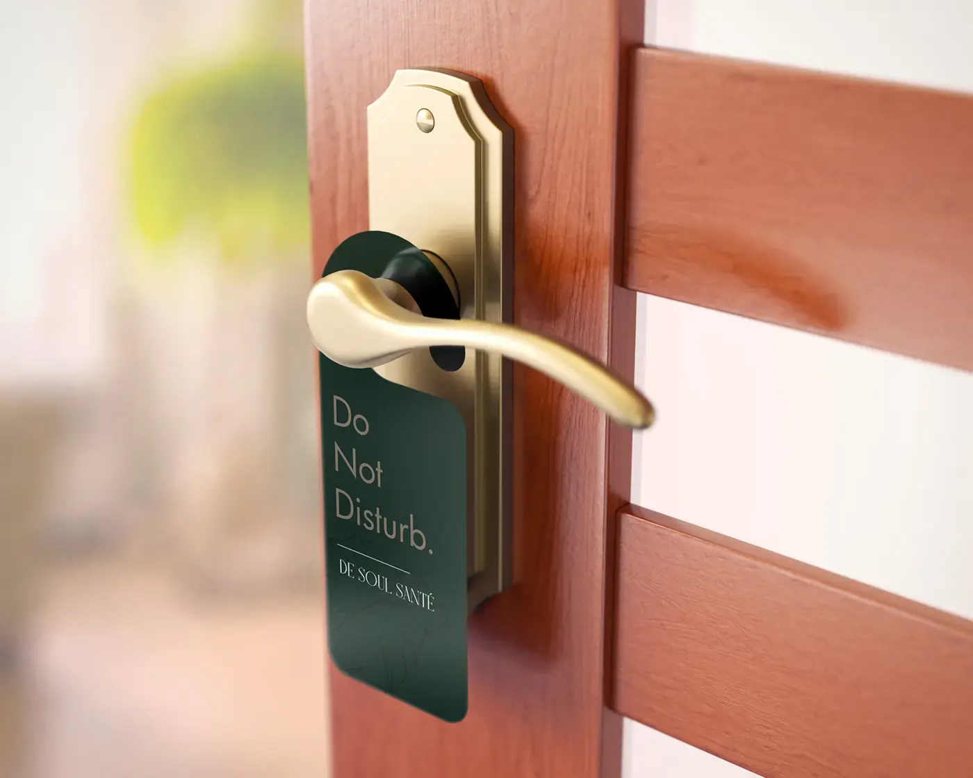 Deep green De Soul Santé do-not-disturb sign on a guest-room door