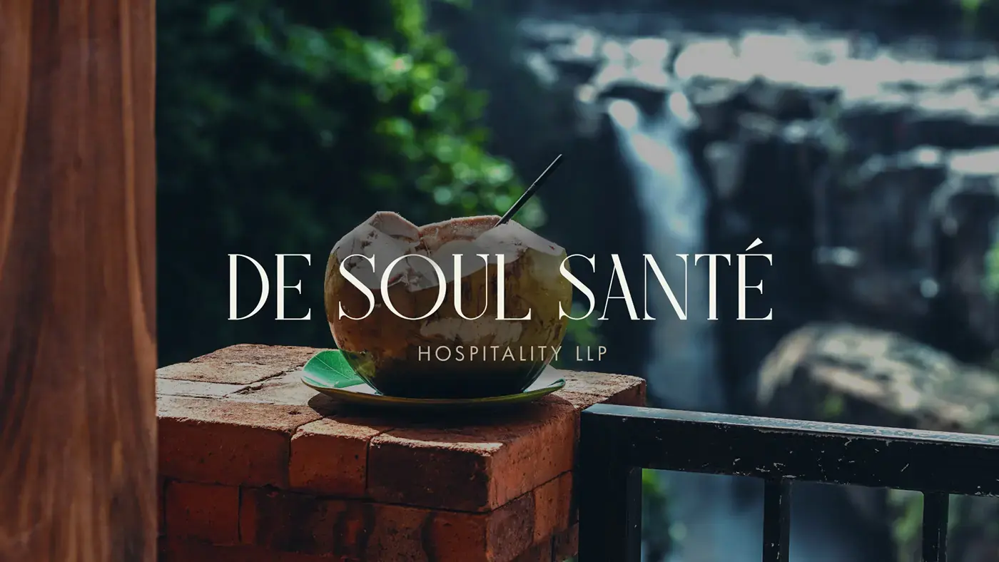 De Soul Santé Hospitality wordmark over a lush resort landscape