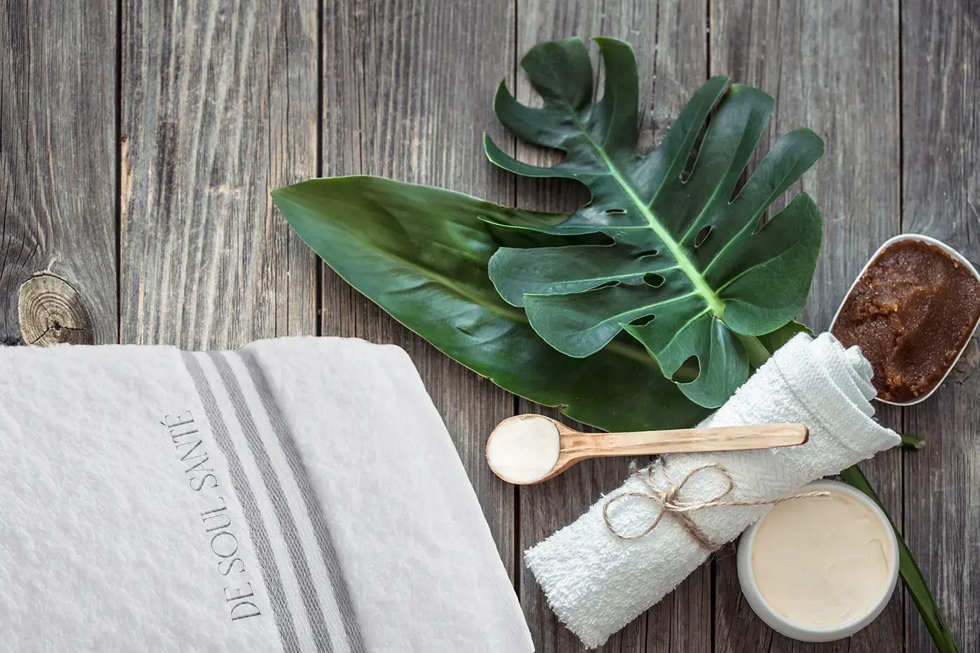 De Soul Santé embroidered towel with botanical spa accessories