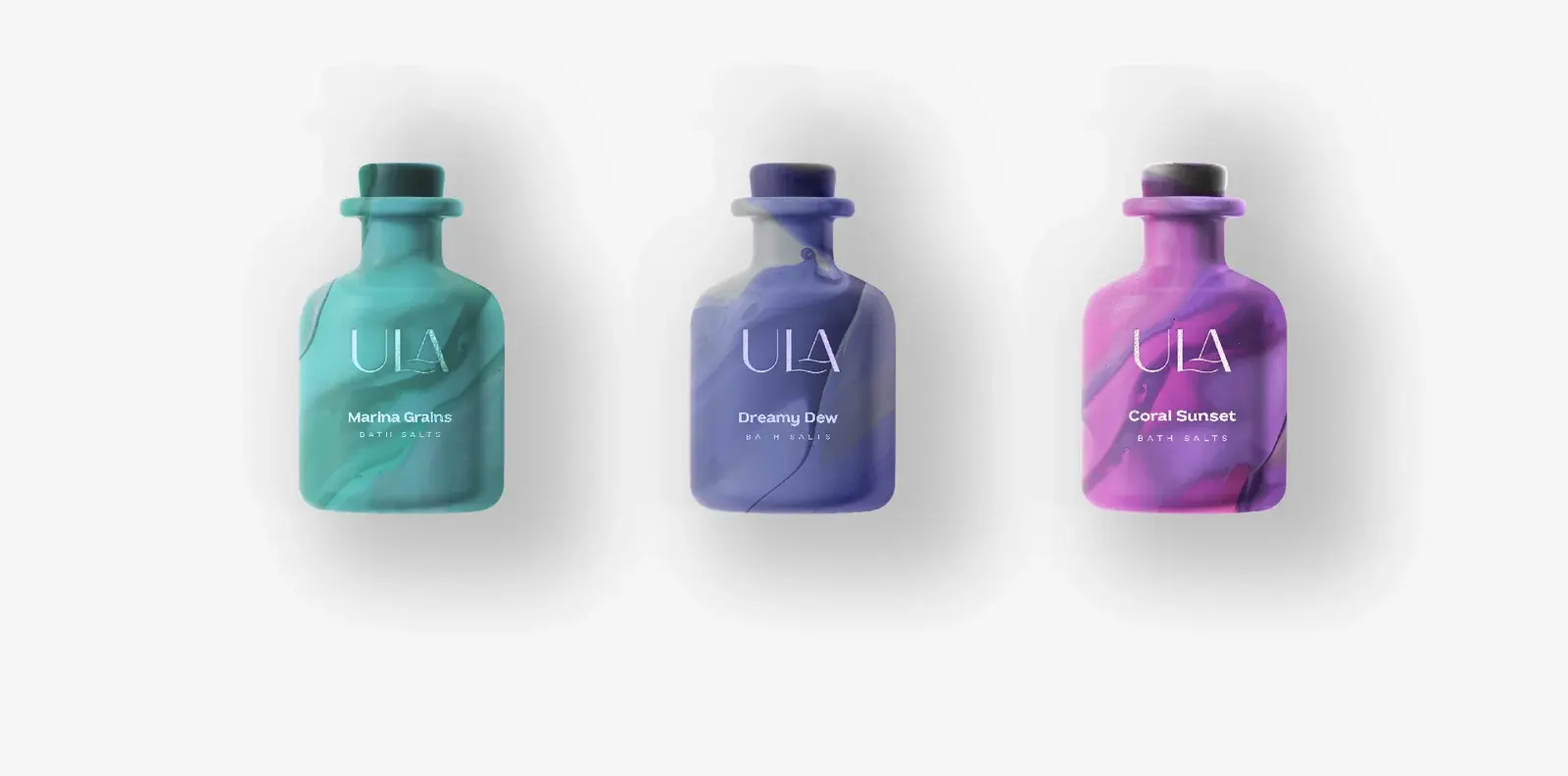 Three ULA bath-salt bottles in turquoise, violet and magenta